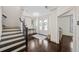 Spacious entryway with dark wood floors, leading to the main living areas at 203 Hubbard Rd, Woodstock, GA 30188