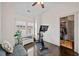 Bright exercise room with workout bike, bench, and an organized walk-in closet at 203 Hubbard Rd, Woodstock, GA 30188