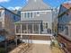 Rear exterior view of home showcasing a screened-in porch and convenient carport at 203 Hubbard Rd, Woodstock, GA 30188