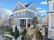 Beautiful home with manicured landscaping and a lovely balcony on the first story at 203 Hubbard Rd, Woodstock, GA 30188