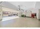 Spacious garage with epoxy floors, storage cabinets, and room for multiple vehicles at 203 Hubbard Rd, Woodstock, GA 30188