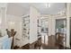 Hallway with hardwood floors and built-in shelves with decorations at 203 Hubbard Rd, Woodstock, GA 30188