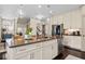 Kitchen island with stainless steel appliances, hardwood floors and pendant lighting at 203 Hubbard Rd, Woodstock, GA 30188