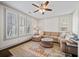 Bright living room showcasing a comfortable sectional sofa and a stylish ceiling fan at 203 Hubbard Rd, Woodstock, GA 30188