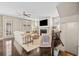 Bright living room featuring a fireplace, ceiling fan, hardwood floors and staircase leading to the next level at 203 Hubbard Rd, Woodstock, GA 30188