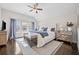 Spacious main bedroom boasting a high ceiling, natural light, and stylish decor at 203 Hubbard Rd, Woodstock, GA 30188
