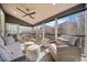 Inviting porch with comfortable seating, ceiling fan, and great view of the outdoor surroundings at 203 Hubbard Rd, Woodstock, GA 30188