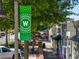 Charming downtown streetscape with a green banner, tree-lined sidewalks, and a variety of local shops and boutiques at 203 Hubbard Rd, Woodstock, GA 30188