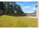 Large backyard with lawn and a wooden privacy fence at 5253 Rosewood Pl, Fairburn, GA 30213