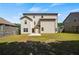 Spacious backyard featuring lush green grass and a privacy fence at 5253 Rosewood Pl, Fairburn, GA 30213