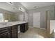 Bathroom featuring double sinks, soaking tub, and glass shower at 5253 Rosewood Pl, Fairburn, GA 30213