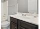Bathroom featuring a vanity with dark cabinets and a shower/tub combo at 5253 Rosewood Pl, Fairburn, GA 30213