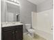Bathroom featuring a vanity with dark cabinets and a shower/tub combo at 5253 Rosewood Pl, Fairburn, GA 30213