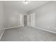 Bedroom featuring multiple doors and neutral paint at 5253 Rosewood Pl, Fairburn, GA 30213