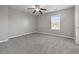 Spacious bedroom with gray carpet and a ceiling fan at 5253 Rosewood Pl, Fairburn, GA 30213