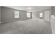 Large bonus room featuring three windows and neutral paint at 5253 Rosewood Pl, Fairburn, GA 30213
