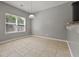 Cozy breakfast nook with tile flooring, a large window, and neutral gray paint for a warm ambiance at 5253 Rosewood Pl, Fairburn, GA 30213