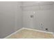 Functional laundry area includes tile flooring and a wire storage shelf at 5253 Rosewood Pl, Fairburn, GA 30213