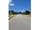 A view of the street, lined with sidewalks and well-maintained homes at 5253 Rosewood Pl, Fairburn, GA 30213