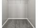 Spacious walk-in closet features carpet and a wire storage shelf at 5253 Rosewood Pl, Fairburn, GA 30213