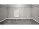 Spacious walk-in closet with wire shelving and gray carpet at 5253 Rosewood Pl, Fairburn, GA 30213