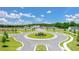 Aerial view of a newly developed community, showcasing the roundabout, tree-lined streets, and modern homes at 8603 Secretariat Dr, Lithonia, GA 30058