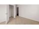 A vacant bedroom features neutral carpeting, white walls, and a walk-in closet for ample storage at 8603 Secretariat Dr, Lithonia, GA 30058