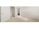 Bedroom featuring neutral carpet with an closet and entrance to another room at 8603 Secretariat Dr, Lithonia, GA 30058