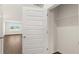 View of a bedroom closet featuring a white rod shelf for optimized storage at 8603 Secretariat Dr, Lithonia, GA 30058