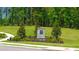 A stone community sign with the letters 'CR' is flanked by mature landscaping, inviting residents and visitors at 8603 Secretariat Dr, Lithonia, GA 30058