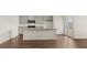 Well-appointed kitchen with gray cabinets, stainless steel appliances, granite counters and a spacious layout with a large island at 8603 Secretariat Dr, Lithonia, GA 30058