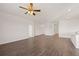 Expansive living room boasts laminate floors, neutral walls, recessed lighting, and ceiling fan at 8603 Secretariat Dr, Lithonia, GA 30058