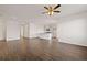 Open living space connects to the kitchen and features hard surface floors and neutral color palette at 8603 Secretariat Dr, Lithonia, GA 30058