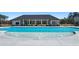 Zero entry pool in community featuring blue water and covered pavilion in background at 8603 Secretariat Dr, Lithonia, GA 30058