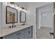 Modern bathroom features double sinks, sleek fixtures, and a bright, airy design with an open doorway at 3286 Elwin Ragsdale Way, Acworth, GA 30102