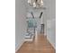 Inviting foyer with hardwood floors, staircase, and fireplace beyond at 3286 Elwin Ragsdale Way, Acworth, GA 30102