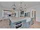 Bright and airy kitchen with stainless steel appliances, a farmhouse sink, and a view into the living area at 3286 Elwin Ragsdale Way, Acworth, GA 30102