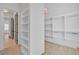 Spacious walk-in closet with custom shelving and hanging racks at 3286 Elwin Ragsdale Way, Acworth, GA 30102