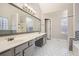 Main bathroom with double sink vanity and tiled flooring at 4030 Staghorn Ct, Douglasville, GA 30135