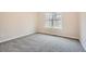 Cozy bedroom with carpet flooring and a window at 4030 Staghorn Ct, Douglasville, GA 30135