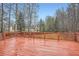 Spacious wooden deck offers scenic views of surrounding trees and backyard at 4030 Staghorn Ct, Douglasville, GA 30135