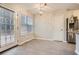 Bright dining area with large windows and stainless steel refrigerator at 4030 Staghorn Ct, Douglasville, GA 30135