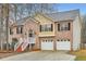 Charming two-story brick home with a well-maintained lawn and attached two-car garage at 4030 Staghorn Ct, Douglasville, GA 30135
