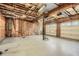Unfinished garage space with visible insulation and a double garage door at 4030 Staghorn Ct, Douglasville, GA 30135