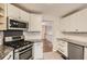 Modern kitchen with stainless steel appliances, granite countertops, and white cabinetry at 4030 Staghorn Ct, Douglasville, GA 30135