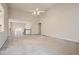 Spacious living room featuring high ceilings, neutral carpeting, and a view of the home's entryway at 4030 Staghorn Ct, Douglasville, GA 30135