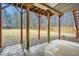 Covered patio space with wooden support beams and views of the backyard at 4030 Staghorn Ct, Douglasville, GA 30135