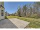 Spacious backyard featuring a concrete patio and a lush green lawn perfect for outdoor enjoyment at 4157 Medlock Woods Dr, Snellville, GA 30039