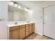 Bathroom featuring double sinks, a large mirror, and tile flooring at 4157 Medlock Woods Dr, Snellville, GA 30039