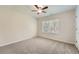 Cozy bedroom with a window for natural light and a ceiling fan at 4157 Medlock Woods Dr, Snellville, GA 30039